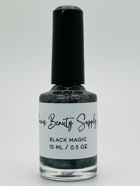 Black Magic non-toxic nail polish in pitch-black with silver sparkles, handmade for bold and glamorous home manicures.