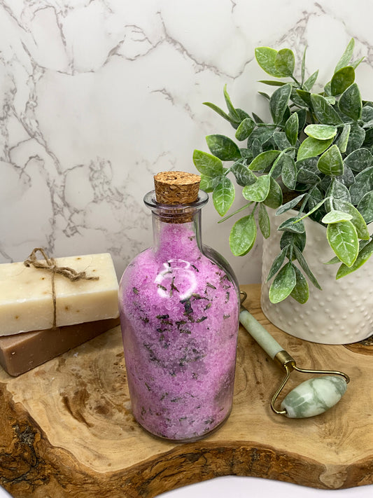 Jar filled with handmade calming lavender bath salt soak, perfect for a relaxing and skin-softening bath experience.