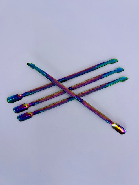 Metal cuticle pusher for precise and gentle cuticle care, designed for adult use in home manicures.