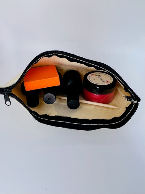 Inside view of the Polish Supply Bag filled with nail polish bottles and supplies, showcasing its compact, organized design.
