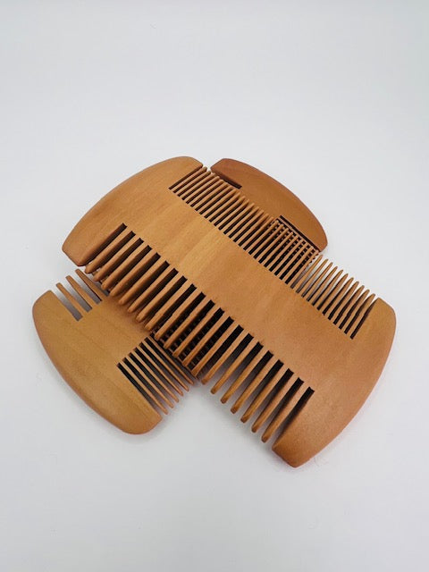 Dual-sided beard comb for grooming short and long beards, designed for easy styling and product distribution.