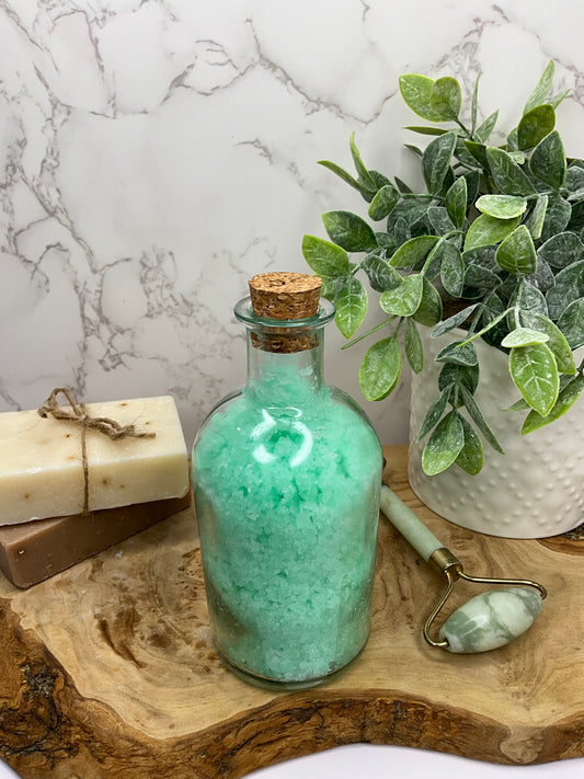 Vapor Bath Salt Soak jar full of soothing Eucalyptus, Lavender, Tea Tree, and Peppermint blend for clear breathing and relaxation.