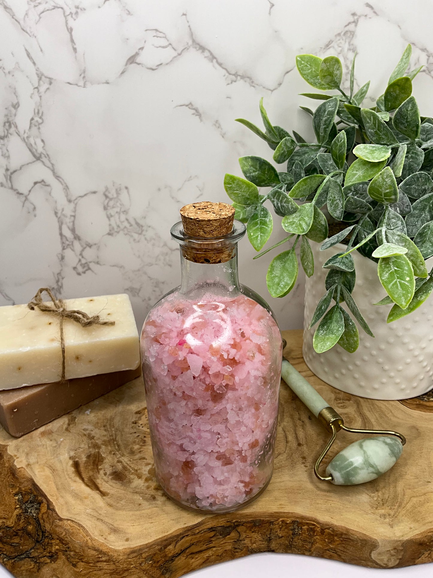 Jar filled with energizing bath salt soak in grapefruit, peppermint, and lavender blend for a refreshing and moisturizing bath experience.