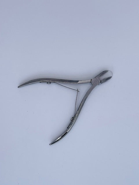 Precision metal cuticle nippers for clean nail prep, ideal for removing excess skin and hang nails; adult use only.